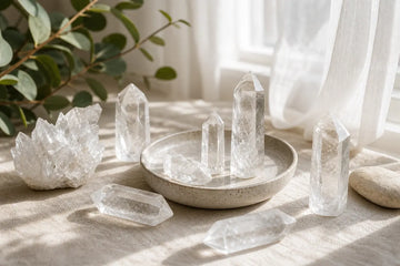 Clear quartz points and clusters glowing in bright natural window light